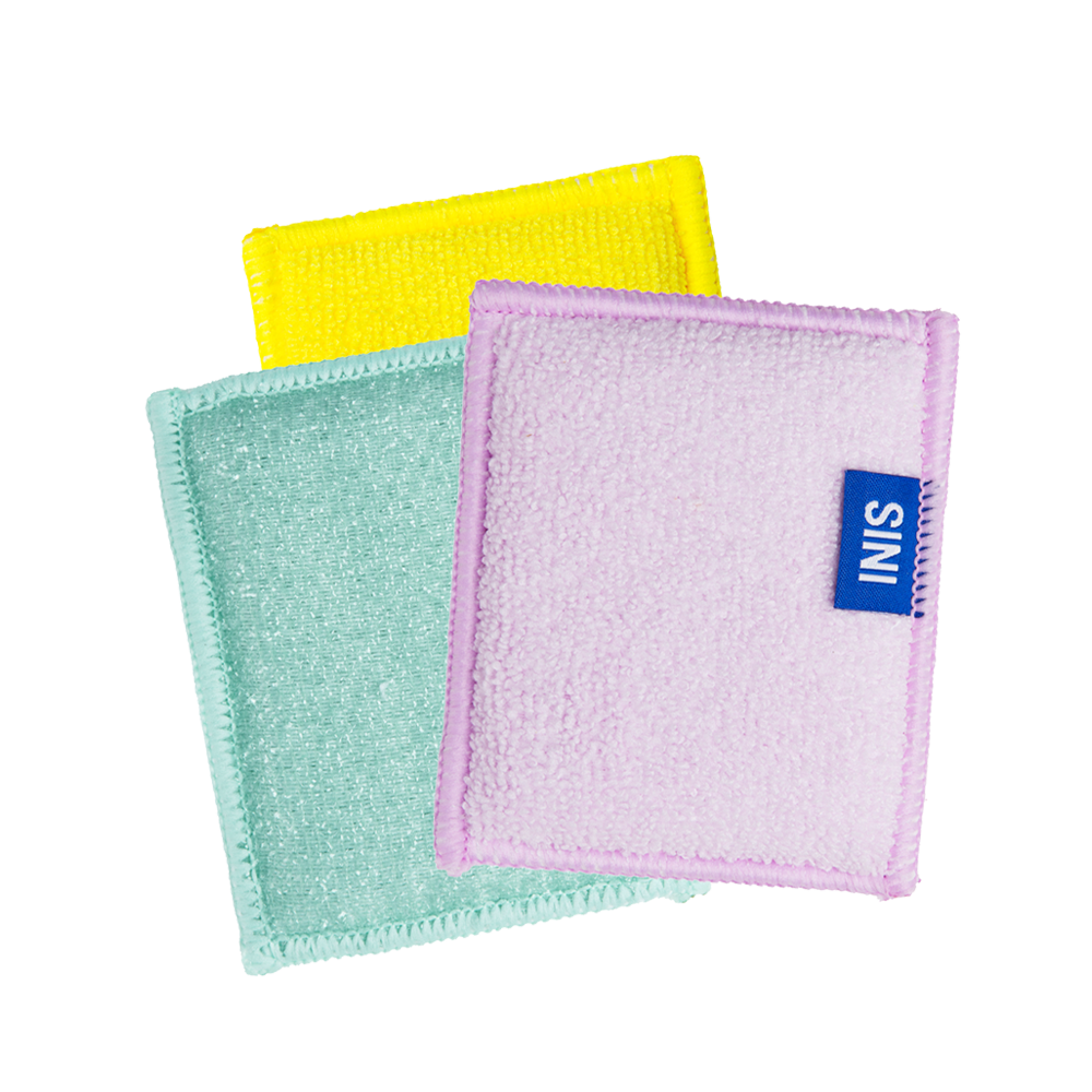 Three colorful washcloths with a visible brand label on a white background